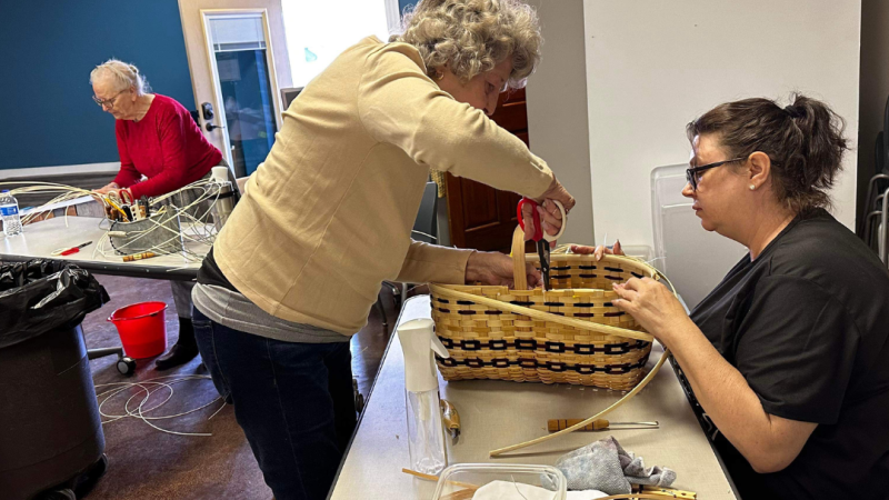 Women Weaving A Basket